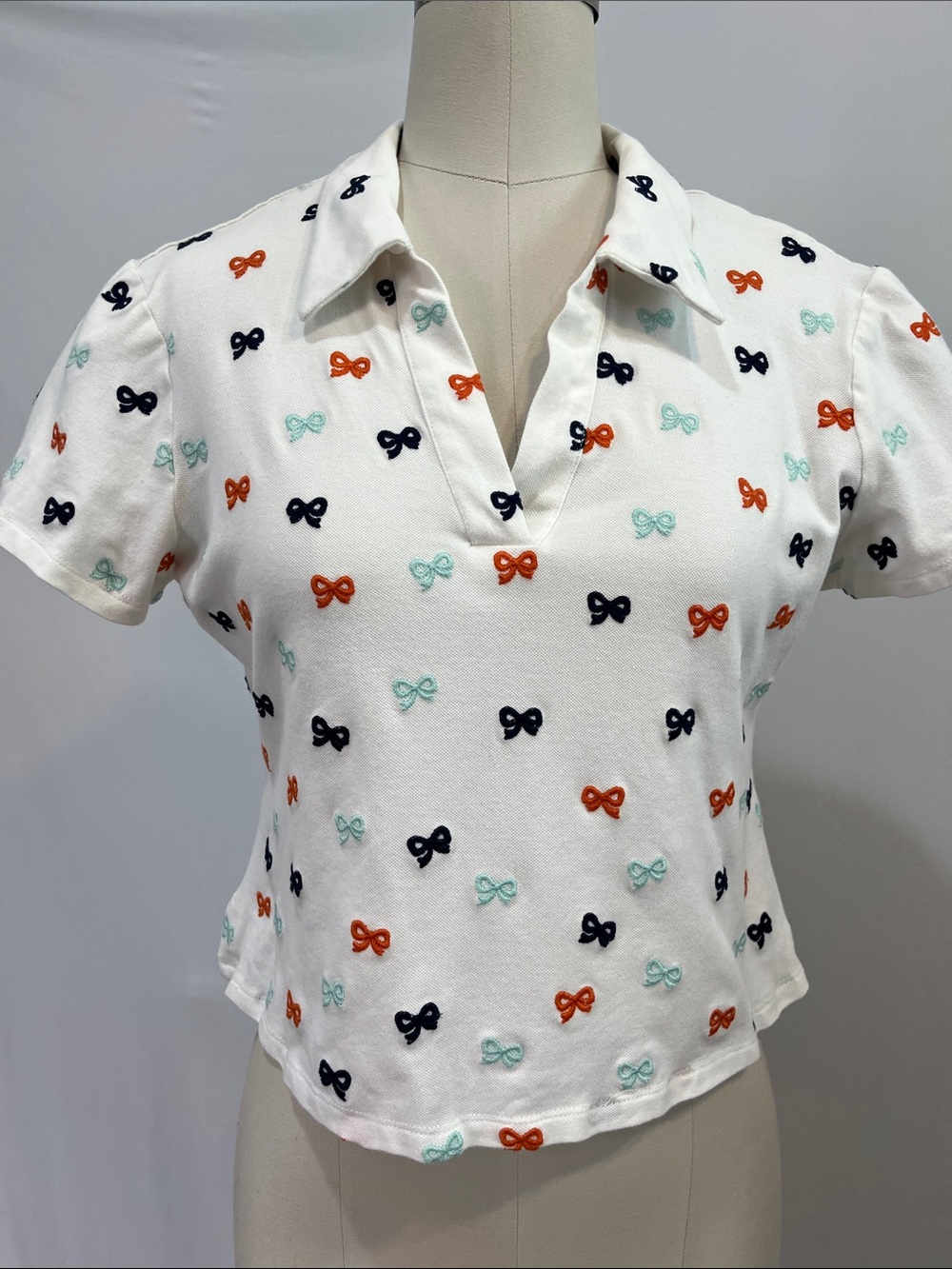 Anthropologie White Cropped Polo Top with Navy, Orange & Mint Bows